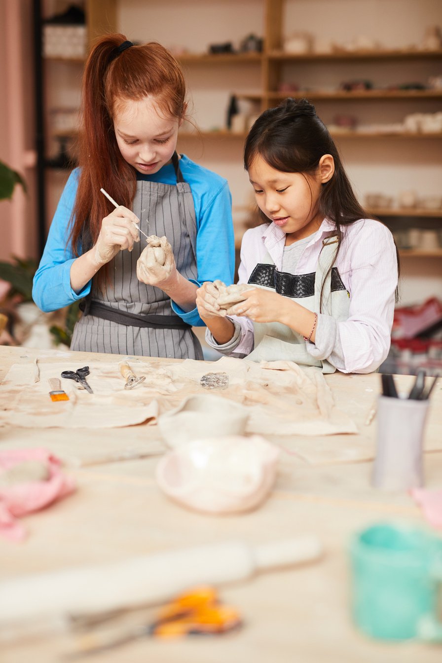 Two Girls in Pottery Workshop